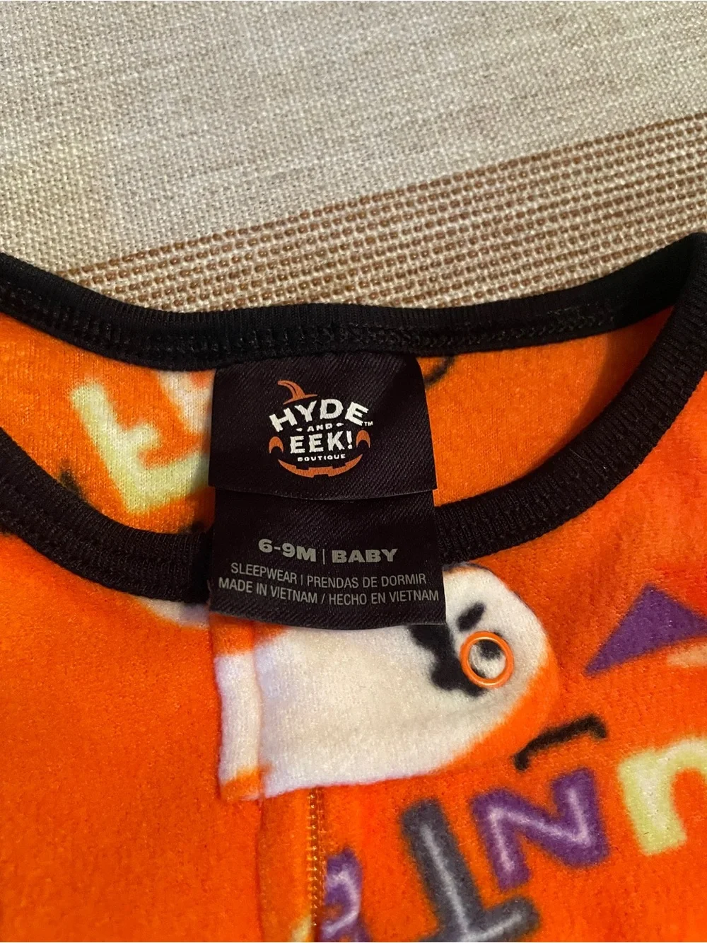 Orange Baby Sleepwear with Black Trim and Purple & White Ghosts